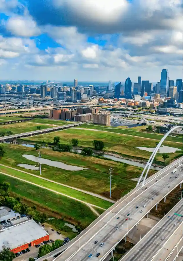 City and green space landscape with highway